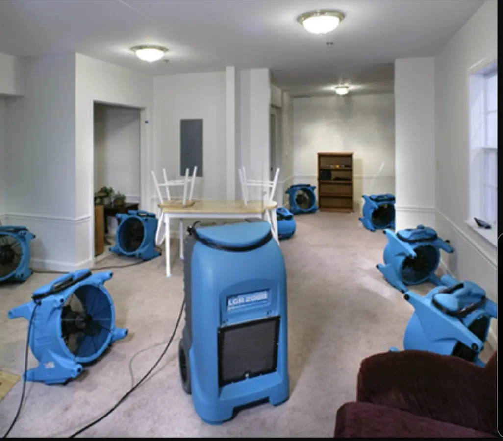 Air movers and dehumidifier setup for Water Damage Restoration in Chili